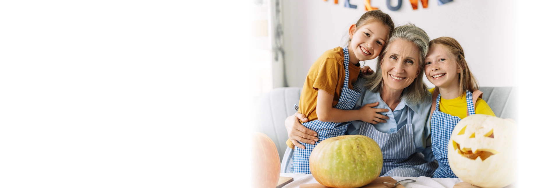 Life Assure Senior Gradnmother With Grandaughters Carving Pumpkins Hero